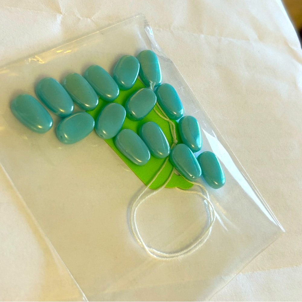 1 Bag of Sea Blue oval twist shape beads. For DIY jewelry making or anything.